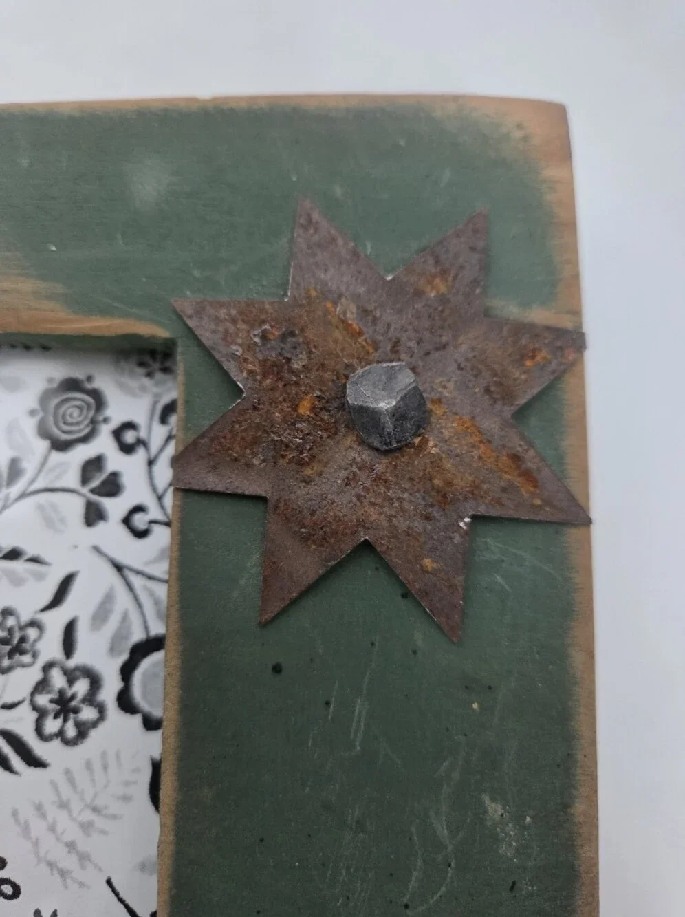 Distressed Vintage Green Wooden Frame with Rustic Metal Star Accent Landscape